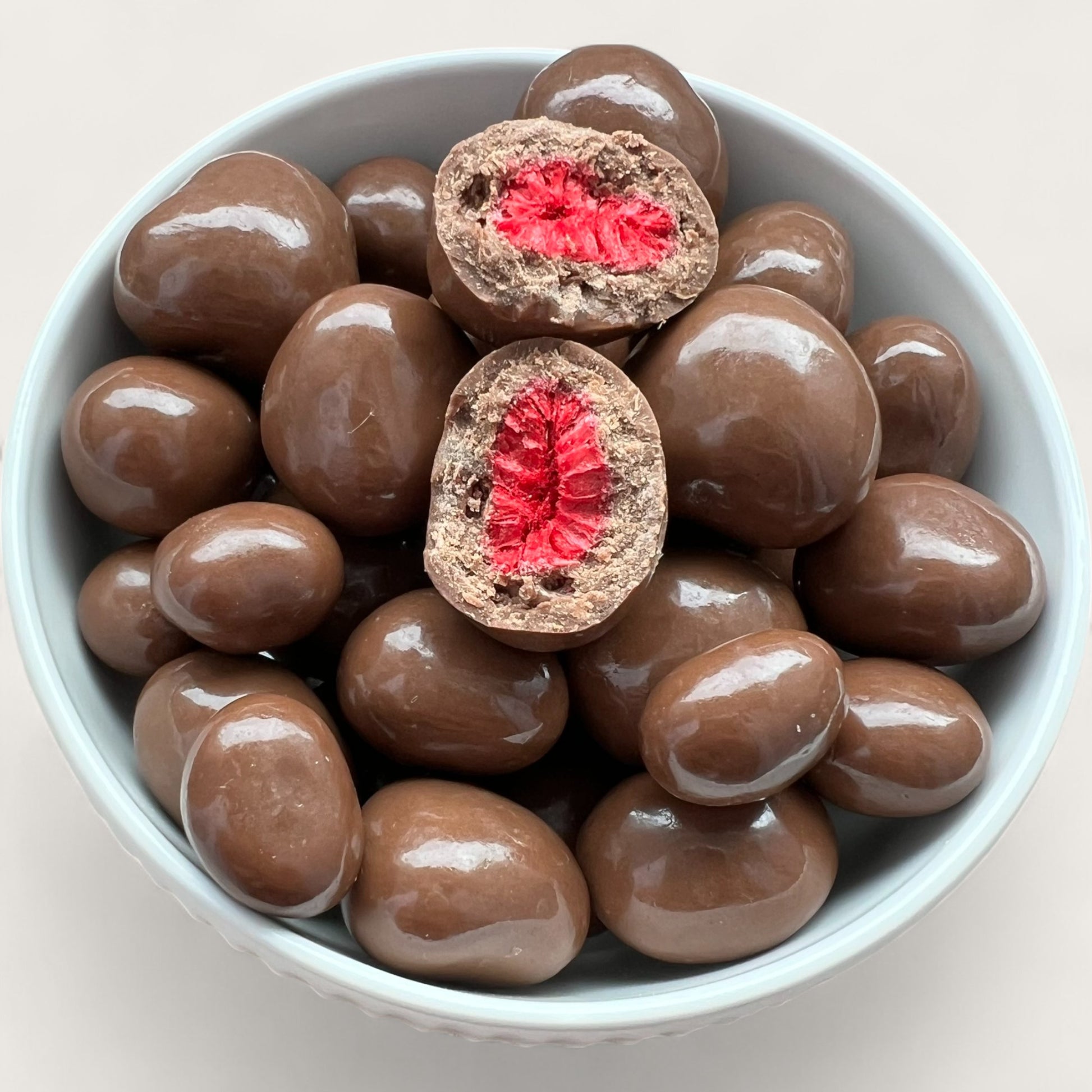 Gefriergetrocknete Himbeeren in Vollmilchschokolade – 100 g - Kemberly® GmbH